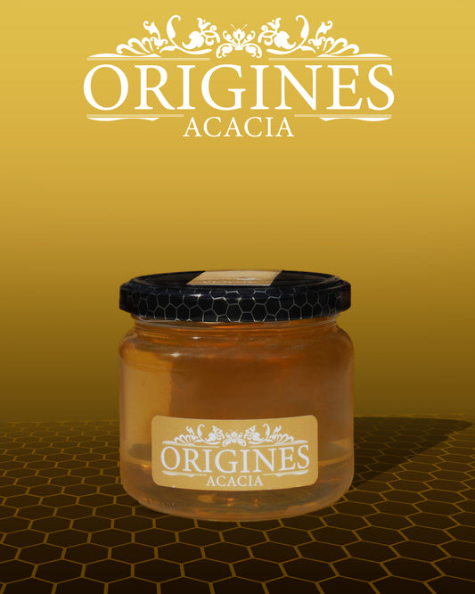Notre pot de miel d'Acacia de 450 g, étiqueté avec soin, contenant un miel doré et lumineux.